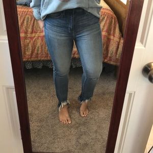 Sneak peek high-rise frayed jeans